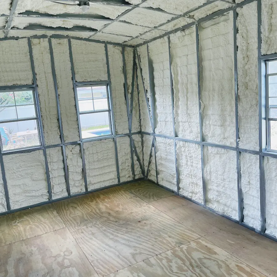 Closed-cell spray foam insulation applied to wall cavities in a residential project in Stoneham